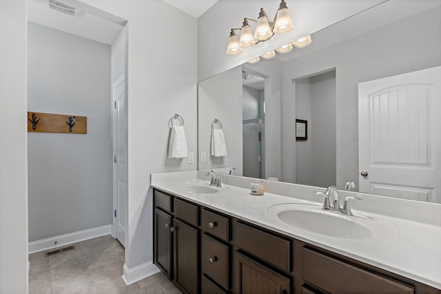 full bath with visible vents, a sink, and double vanity