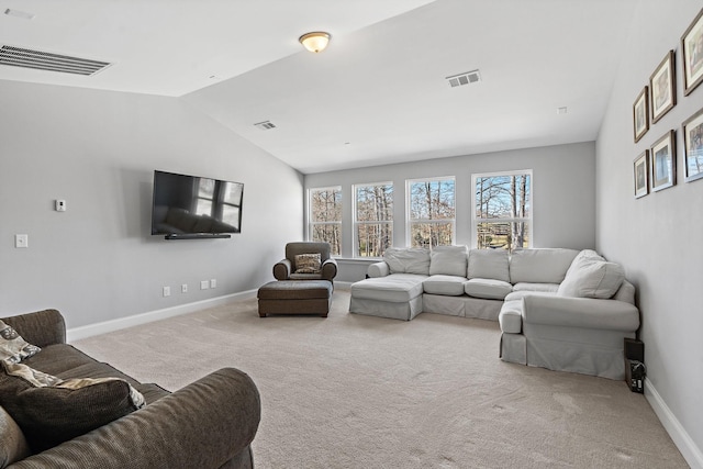 living room with carpet floors, visible vents, vaulted ceiling, and baseboards