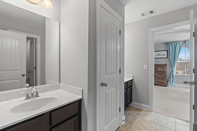 full bathroom with tile patterned floors, baseboards, visible vents, and vanity