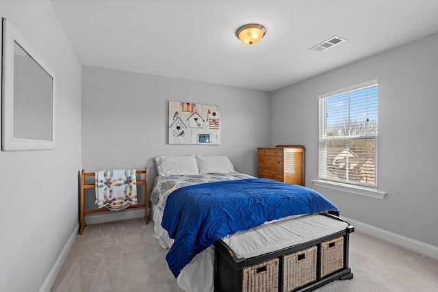 bedroom featuring light carpet, baseboards, and visible vents