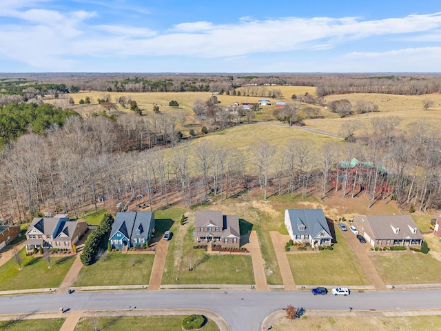 birds eye view of property featuring a rural view