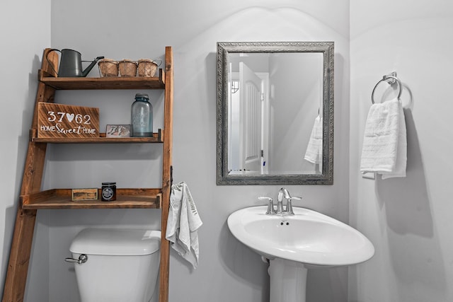 bathroom featuring toilet and a sink