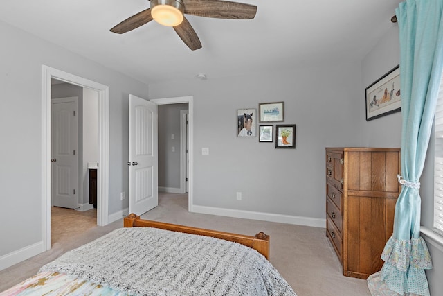 bedroom with ceiling fan, baseboards, and light colored carpet