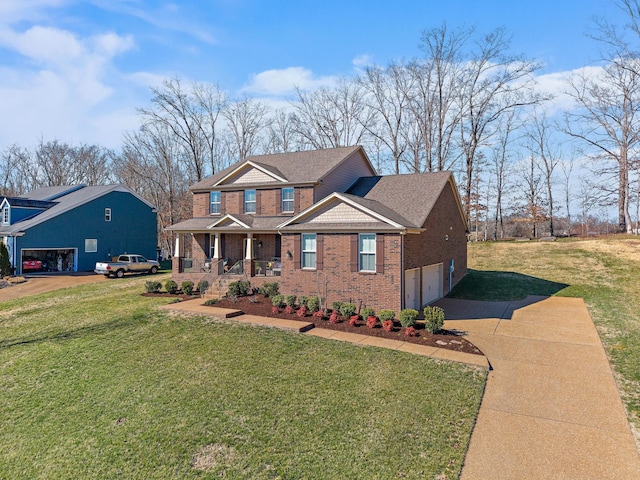 view of front of home featuring driveway, a garage, a front lawn, and brick siding