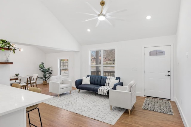 living area with recessed lighting, light wood-type flooring, and baseboards