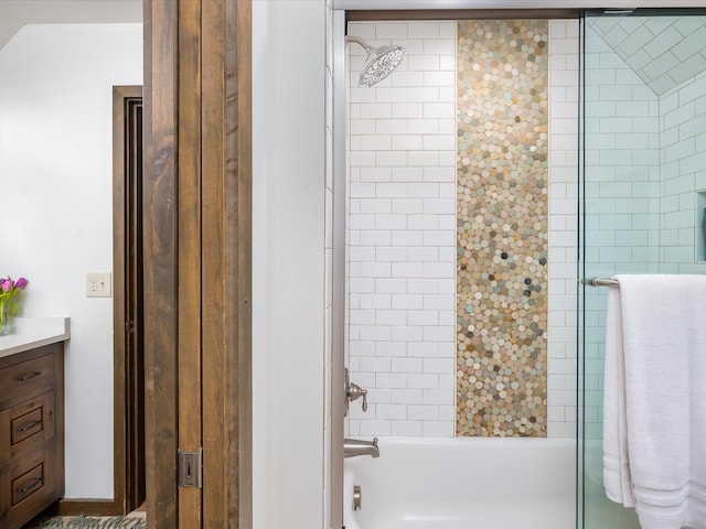 bathroom with shower / bathing tub combination and vanity