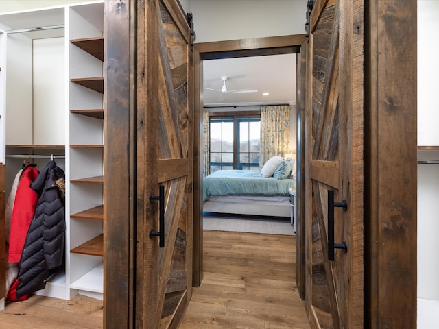 interior space featuring a barn door and wood finished floors