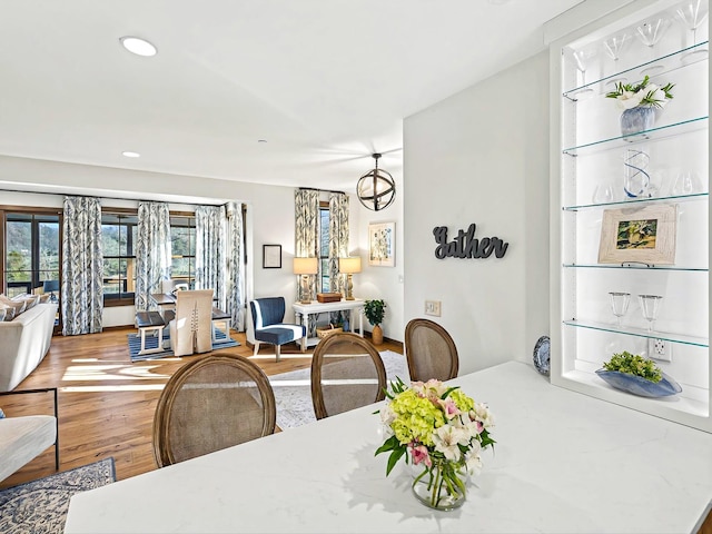 dining room featuring wood finished floors and recessed lighting