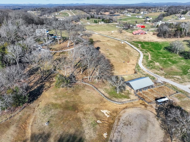 birds eye view of property with a rural view