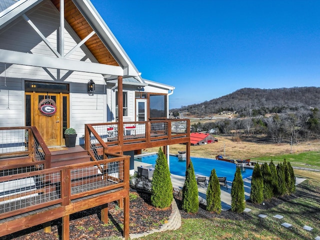 exterior space with a deck with mountain view