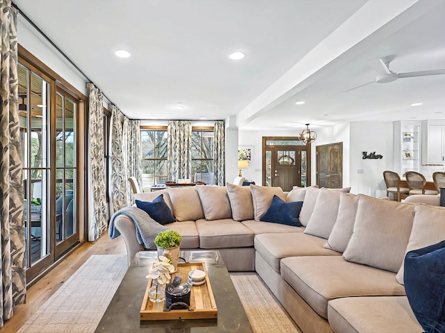 living room featuring recessed lighting, ceiling fan, and wood finished floors