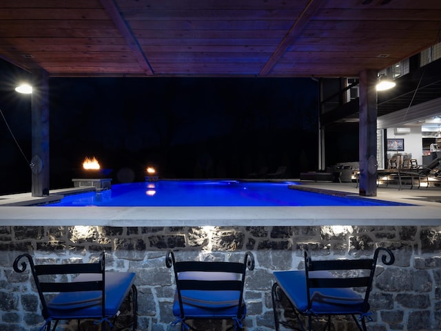 bar with a dry bar and wood ceiling