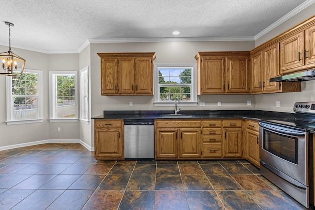 kitchen featuring stainless steel appliances, dark countertops, a sink, and under cabinet range hood