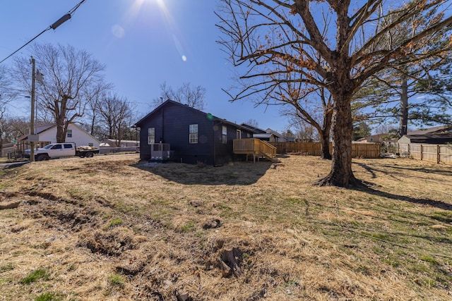 view of property exterior with fence