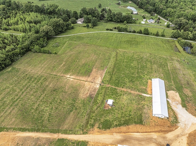 birds eye view of property with a rural view