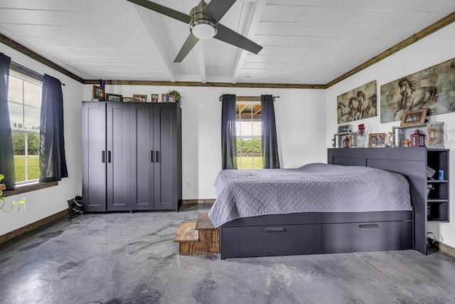 bedroom featuring ceiling fan, beam ceiling, baseboards, and concrete flooring