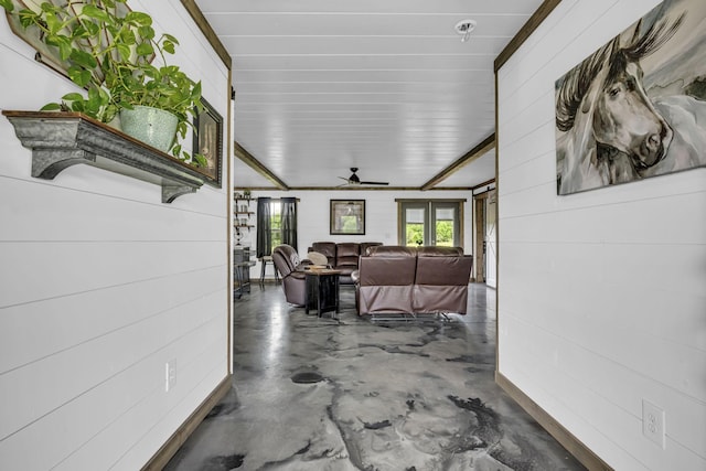 corridor featuring finished concrete floors and french doors