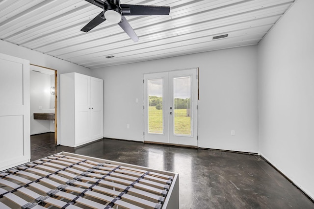 interior space featuring french doors, visible vents, concrete floors, and ceiling fan