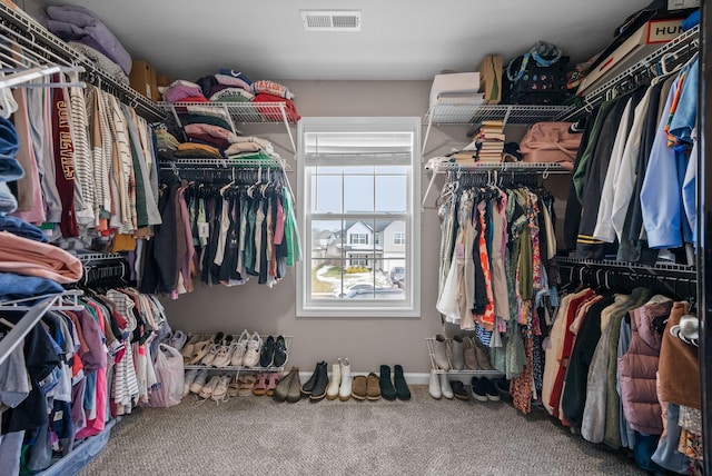 walk in closet with carpet floors and visible vents