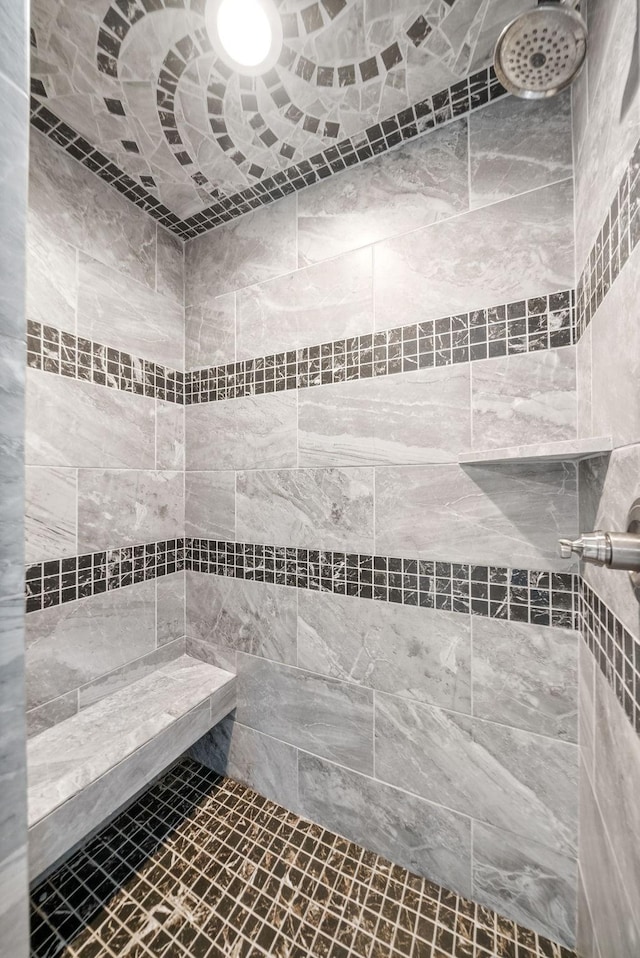 bathroom with tiled shower