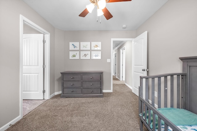 bedroom with carpet floors, baseboards, and a ceiling fan