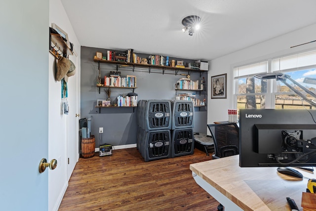 office space with baseboards and wood finished floors