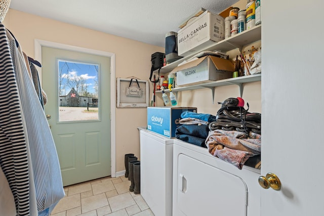 washroom featuring laundry area and washing machine and dryer