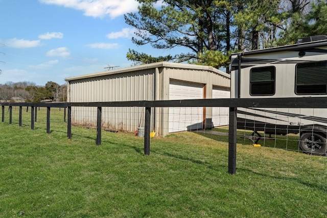 view of outdoor structure featuring an outbuilding and fence