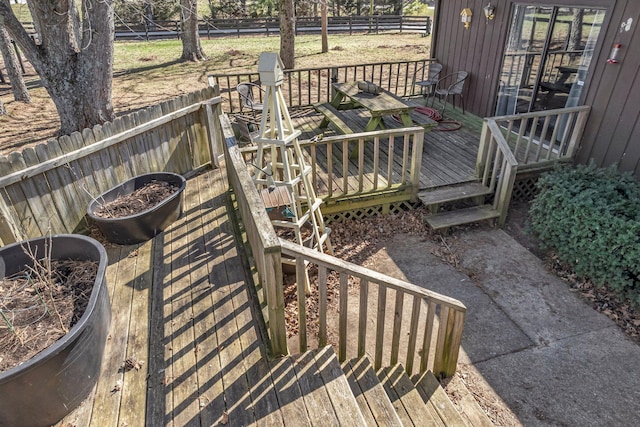 wooden deck featuring fence