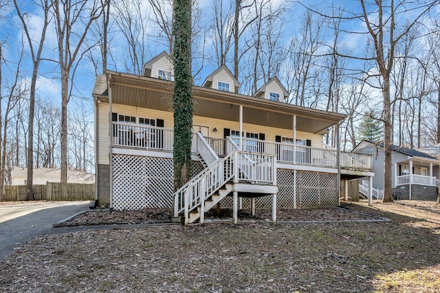 view of front of property featuring a porch and stairway