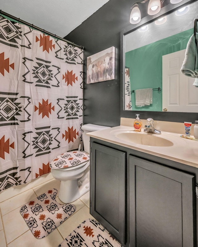 full bathroom with vanity, curtained shower, tile patterned flooring, and toilet