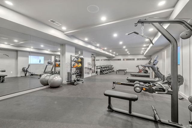 exercise room with visible vents and recessed lighting