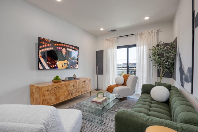 living area with visible vents and recessed lighting