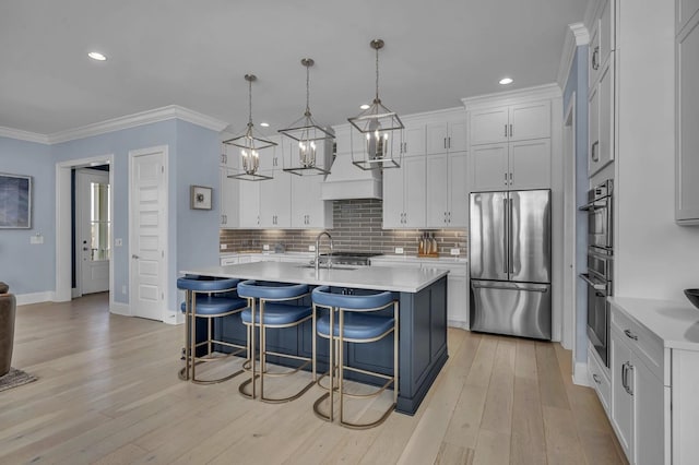 kitchen featuring stainless steel appliances, backsplash, light countertops, and crown molding