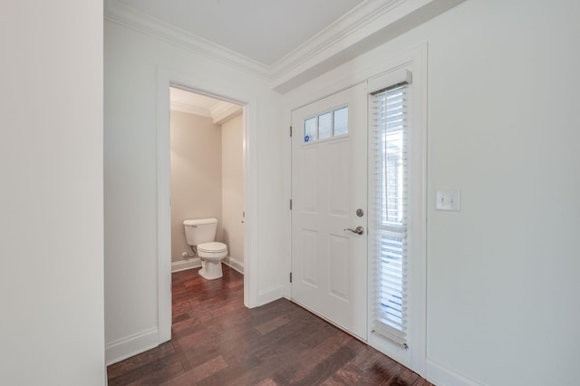 foyer featuring ornamental molding, dark wood finished floors, and baseboards