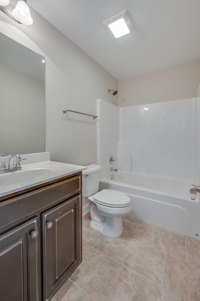 bathroom featuring shower / bathing tub combination, vanity, toilet, and tile patterned floors