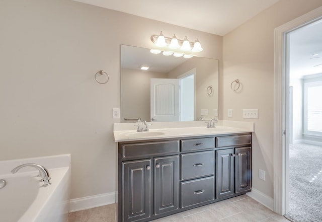 full bathroom featuring tile patterned flooring, a garden tub, a sink, and double vanity