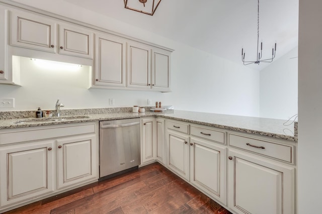 kitchen with dark wood-type flooring, a sink, light stone countertops, a chandelier, and dishwasher