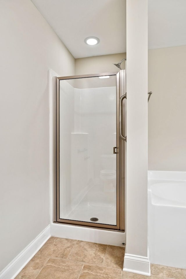 1012 Irish Way, Spring Hill, TN 37174 - full bath featuring a shower stall, a garden tub, baseboards, and toilet