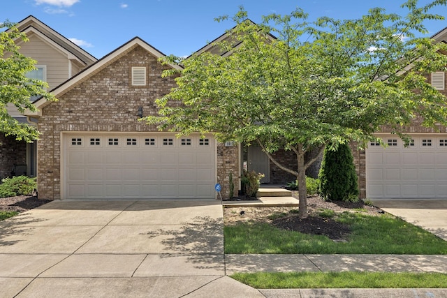 1012 Irish Way, Spring Hill, TN 37174 - view of front of house featuring brick siding, concrete driveway, and an attached garage