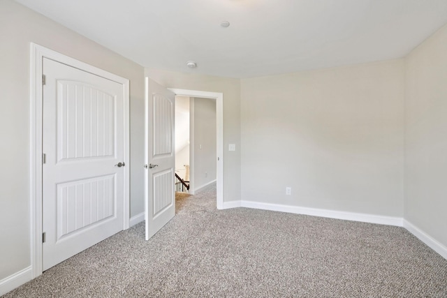1012 Irish Way, Spring Hill, TN 37174 - unfurnished bedroom featuring light carpet and baseboards