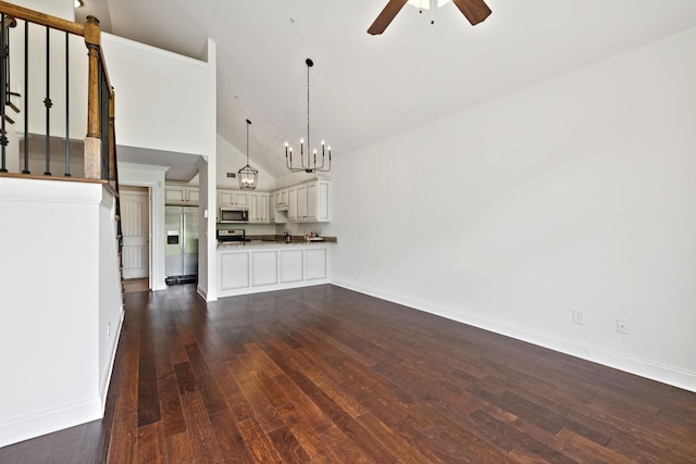 1012 Irish Way, Spring Hill, TN 37174 - unfurnished living room featuring ceiling fan, dark wood-style flooring, baseboards, a chandelier, and high vaulted ceiling