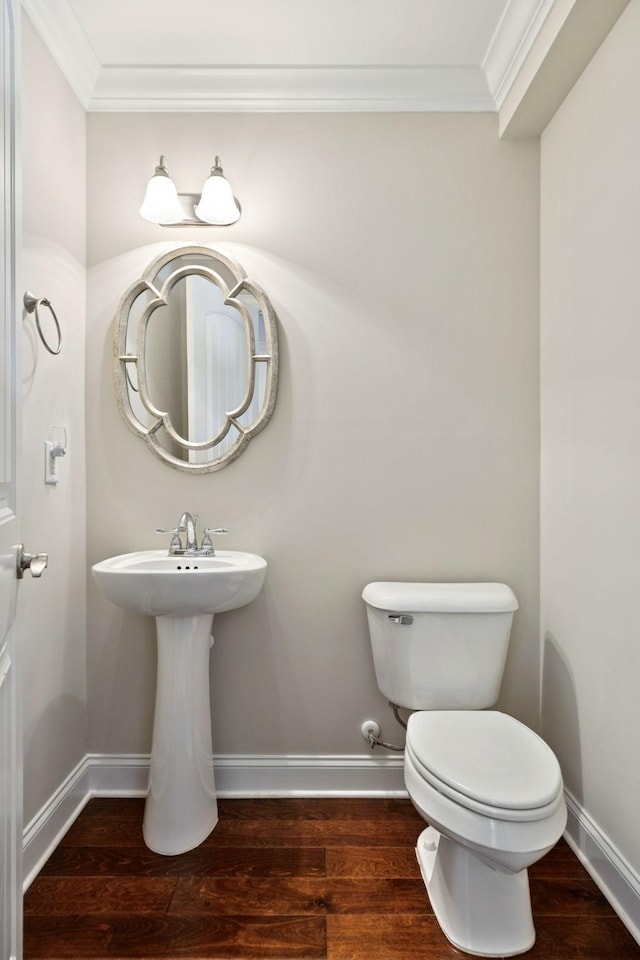 1012 Irish Way, Spring Hill, TN 37174 - bathroom featuring crown molding, baseboards, wood finished floors, and toilet