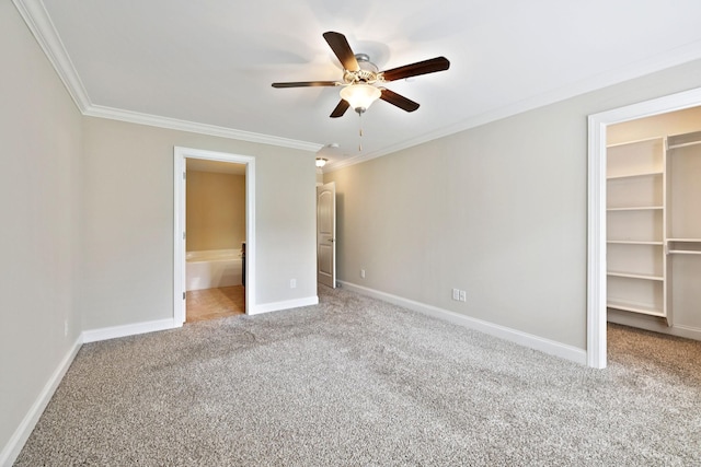 1012 Irish Way, Spring Hill, TN 37174 - unfurnished bedroom featuring a spacious closet, carpet floors, ornamental molding, a closet, and baseboards