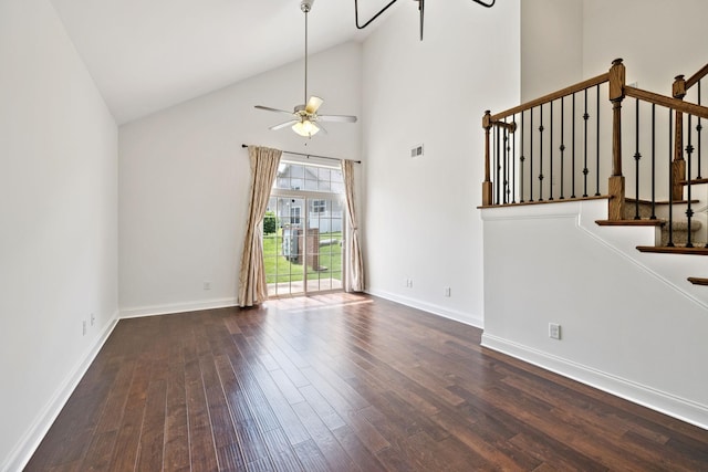 1012 Irish Way, Spring Hill, TN 37174 - unfurnished living room with dark wood finished floors, ceiling fan, stairs, high vaulted ceiling, and baseboards