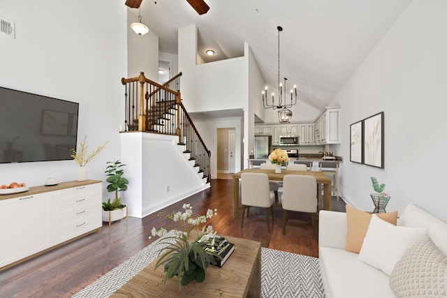 1012 Irish Way, Spring Hill, TN 37174 - living room featuring high vaulted ceiling, dark wood-style floors, stairs, a ceiling fan, and a chandelier