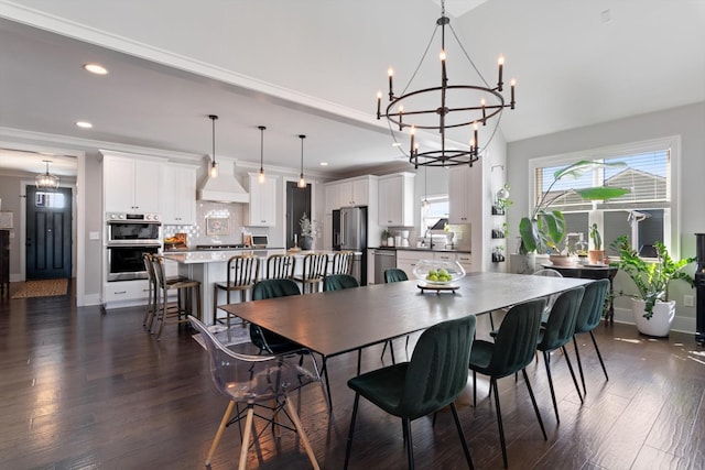 dining space featuring baseboards, dark wood finished floors, crown molding, and recessed lighting