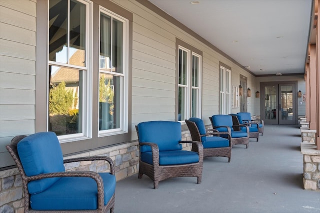 view of patio / terrace featuring a porch and french doors