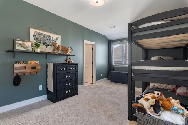 carpeted bedroom featuring baseboards and visible vents