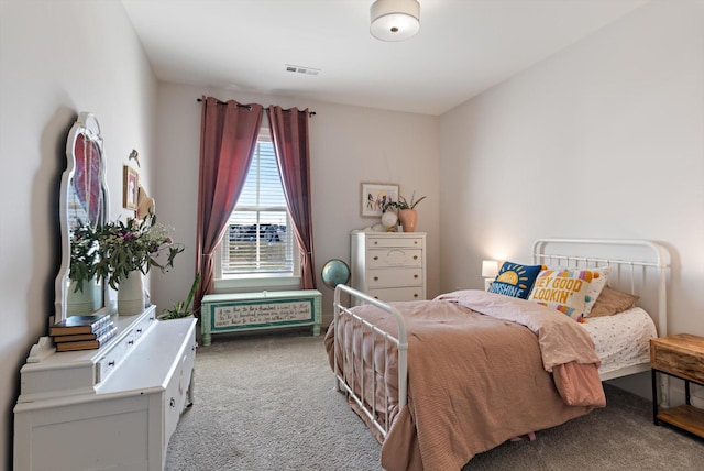 carpeted bedroom with visible vents